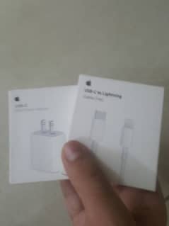 white iphone cable and adapter 20w