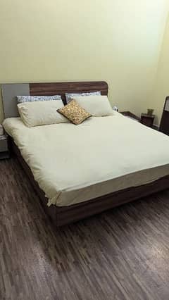 interwood bed with side tables and dressing