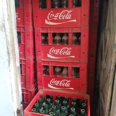 papsi and coke crate with empty bottles