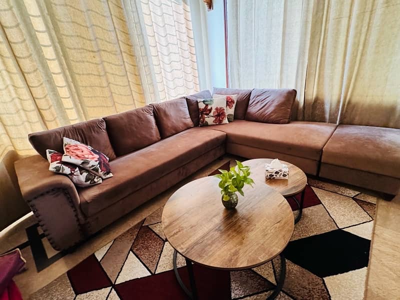 L shaped sofa with one big centre table and imported rug 3