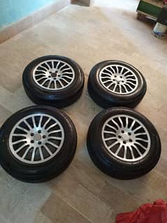 2months used new bridgestone R15 tyres +Alloy rims R15