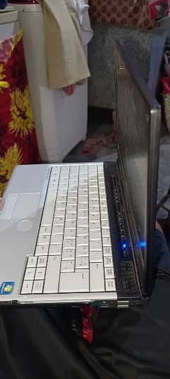 Fujitsu laptop running in window 7 with charger