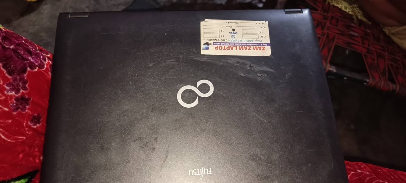 Fujitsu laptop running in window 7 with charger 2