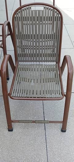 Four Citizen steel frame chairs without plastic seats and backs