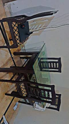 Dining table condition with four chairs.