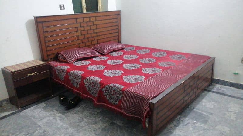 wooden bed with side tables and mattress 6