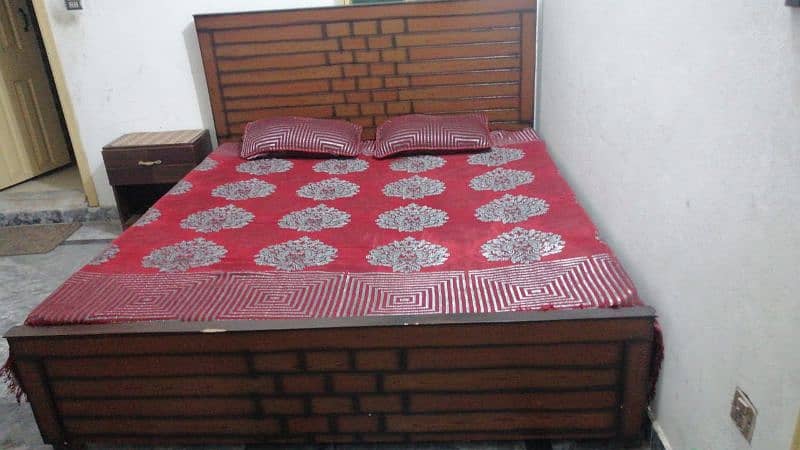 wooden bed with side tables and mattress 7