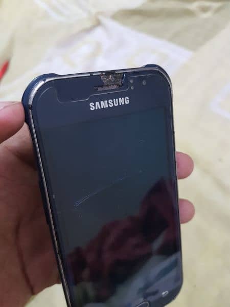 Samsung Galaxy J1 Ace (dead) but can be used for parts. 2