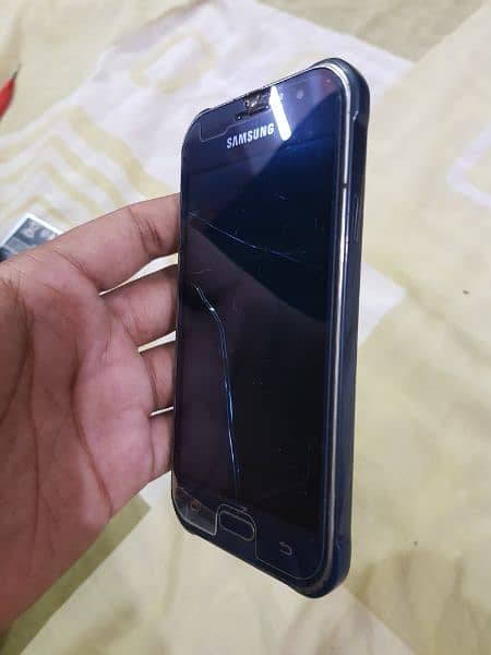 Samsung Galaxy J1 Ace (dead) but can be used for parts. 3