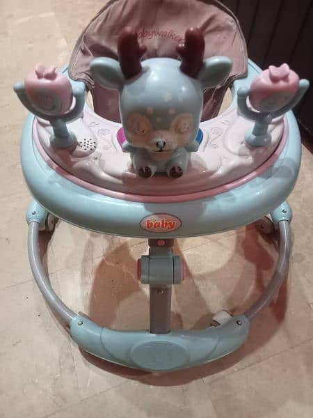 Baby walker and Bathing seat for sale 1