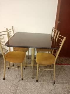 4 chairs and 1 steel mirror table