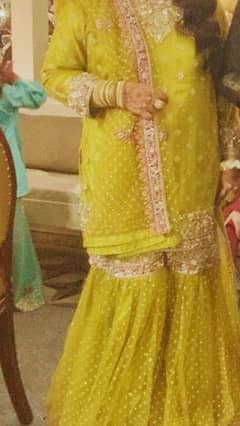 Dhani colored net gharara ,shirt and dupatta with beautiful kora dabka