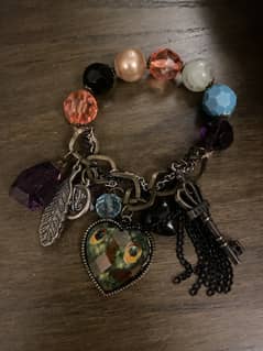 Brand new bracelet with beautiful and colourful charms.