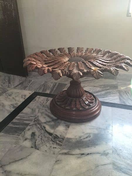 center table made of shisham wood  with a glass on it. 1