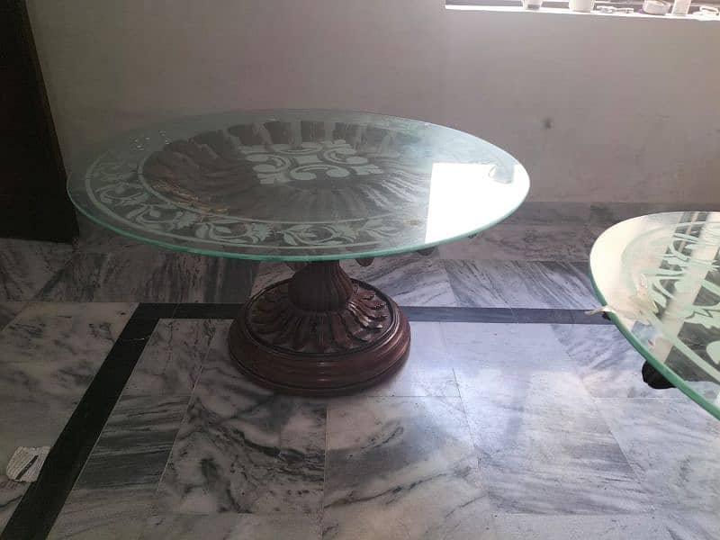 center table made of shisham wood  with a glass on it. 2