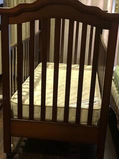 wooden cot of juniors brand