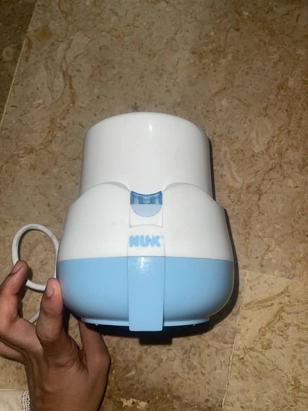 Nuk Warmer 1