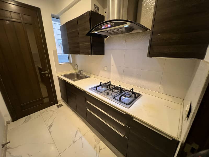 Chic 1-Kanal Fully Furnished Home With 5 Beds, 2 Kitchens, & More In DHA Phase 4 Block HH 19