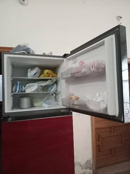 Haier glass door fridge in red colour full size with glass shells. 3