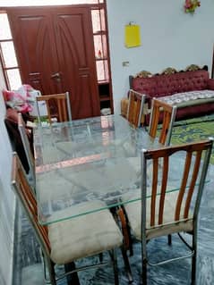 Used dining table with six chairs and 12 mm glass top