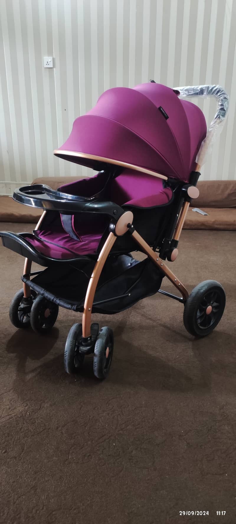 Two prams one in blue one in purple colour 4