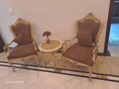 set of two chairs with a table