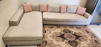 L-SHAPE LIGHT GRAY SOFA WITH PINK CUSHIONS