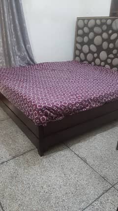 Wooden king size bed in good condition for sale