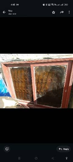 wood window with iron grill