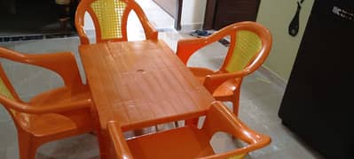 Plastic chairs with table