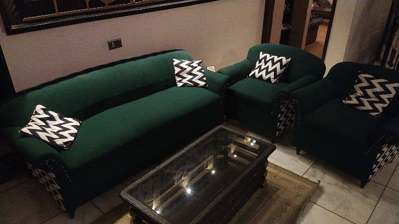 green sofa set with cushions with center table and side tables 1