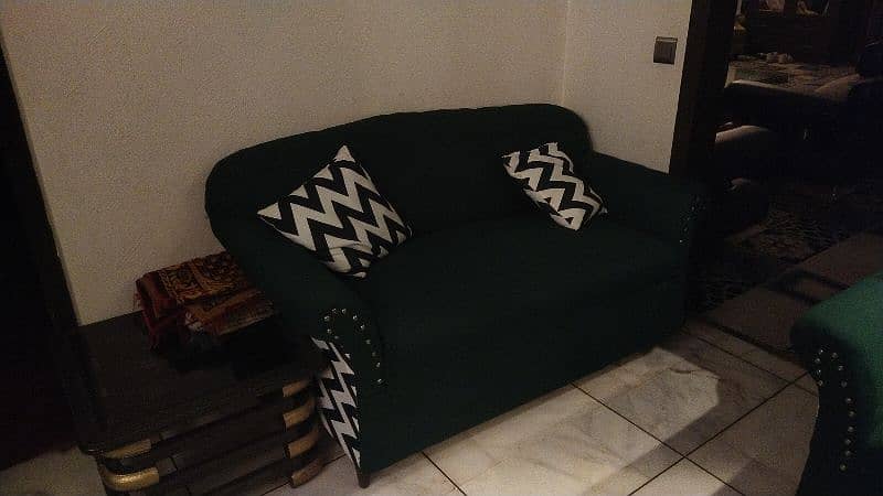 green sofa set with cushions with center table and side tables 2