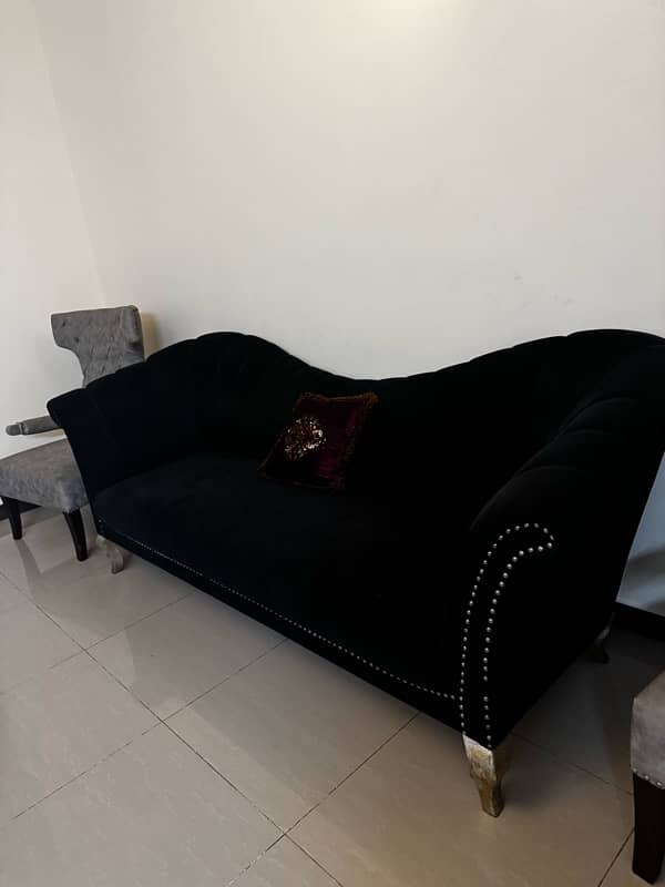 Black modern settee with two contrasting silver grey antique chairs 6