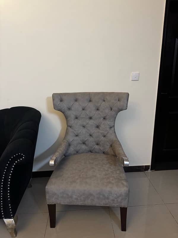 Black modern settee with two contrasting silver grey antique chairs 7