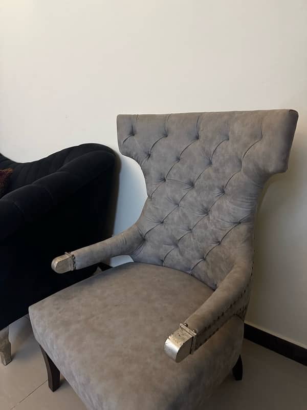 Black modern settee with two contrasting silver grey antique chairs 8