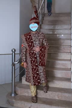 Groom Sherwani Mehroon Colour with Golden Embriodery.