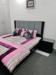 Double bed with side tables dressing table and showcase