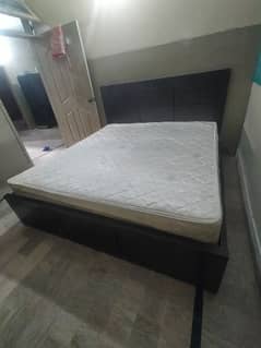 Fancy king size wooden bed along with victoria spring mattress