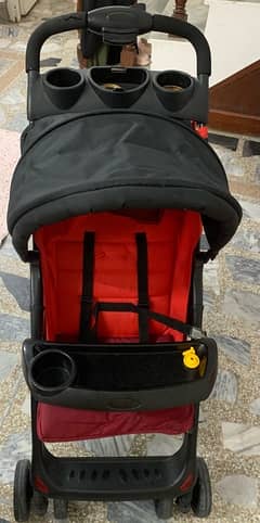 red baby pram