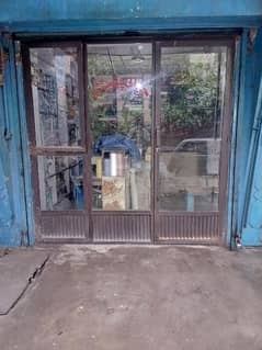 shop counter. . shop door full glass .  front shade steel made