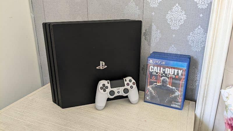 PS4 pro for sale with one original controller and 6 games (Cheap) 1