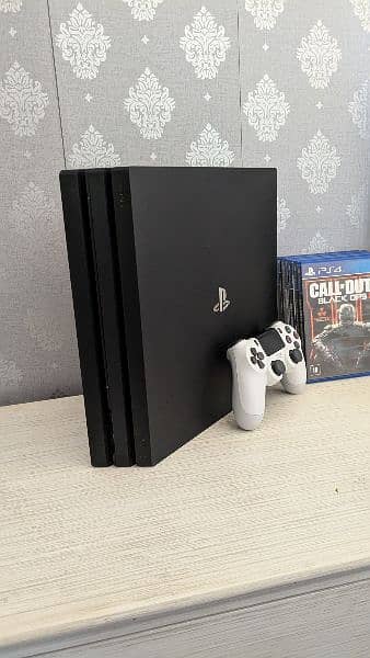 PS4 pro for sale with one original controller and 6 games (Cheap) 3