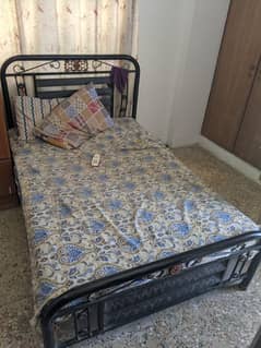 iron bed in good condition blackish colour without mattress