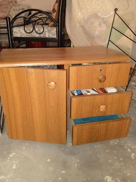 one small cabinet and 3 drawers 3