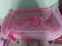 Baby cradle swing with mosquito net.