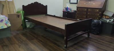 Two single sheesham wood beds with side tables