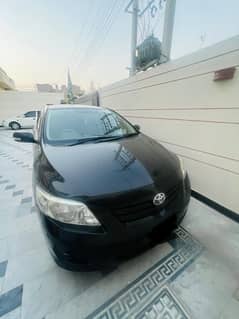 corolla gli 2009 model registered 2010