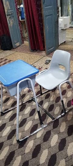 2-Study chairs with desks for sale.