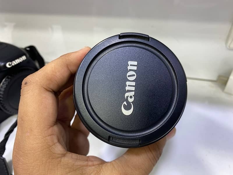 canon camera with charger and lens 4