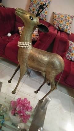 a beautiful copper made deer statue